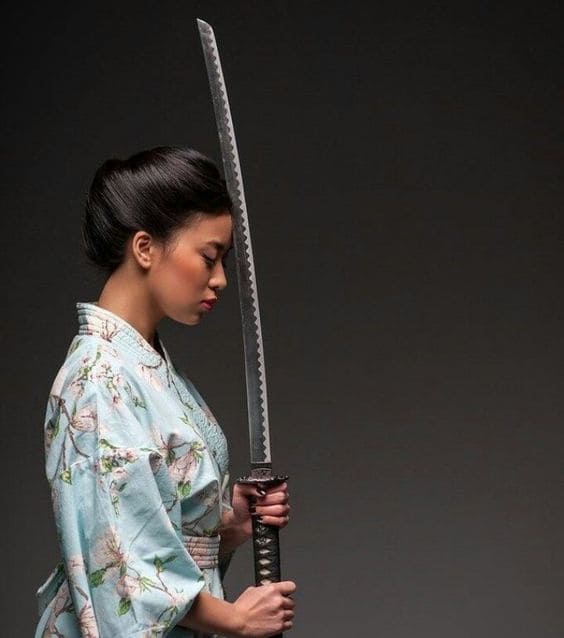 girl in kimono posing with sword leaning on her head