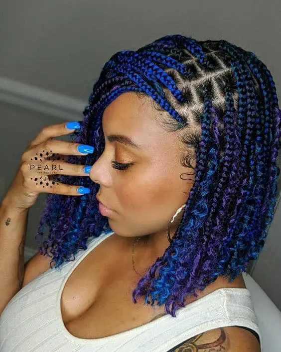 stunning lady with sharp blue short hair braids
